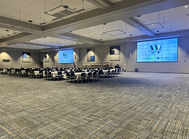 WCTC Anthony J. Natalizio Center with large screens and several tables with chairs
