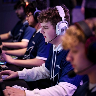 E-sports players concentrating on their screens