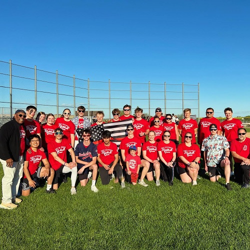 Kickball team posing outdoors