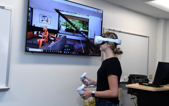 Student using virtual reality headset in Architectural Drafting lab