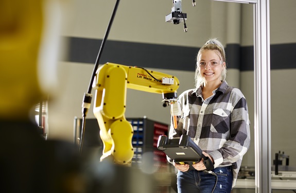 Female student with robotic equipment