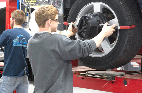 Student changing tire