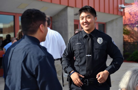 Law enforcement officer smiling outdoors