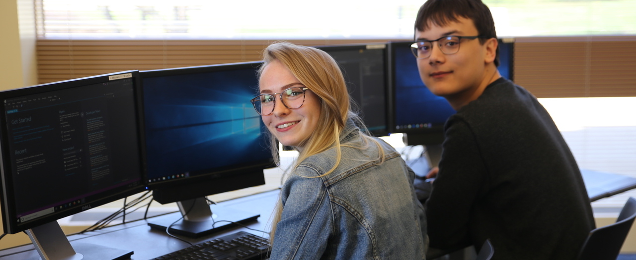 Automation student using robot