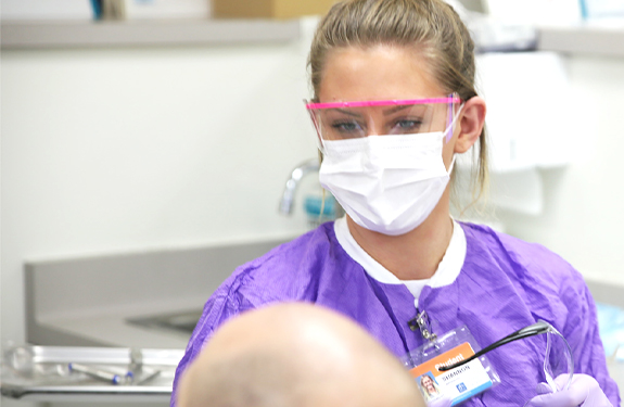 Dental Hygiene student in scrubs