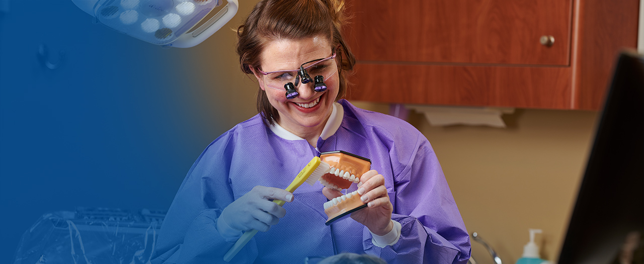 Dental Hygiene student with equipment