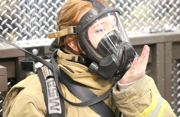 Fire Medic student wearing gear