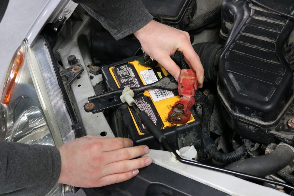 Student testing car battery