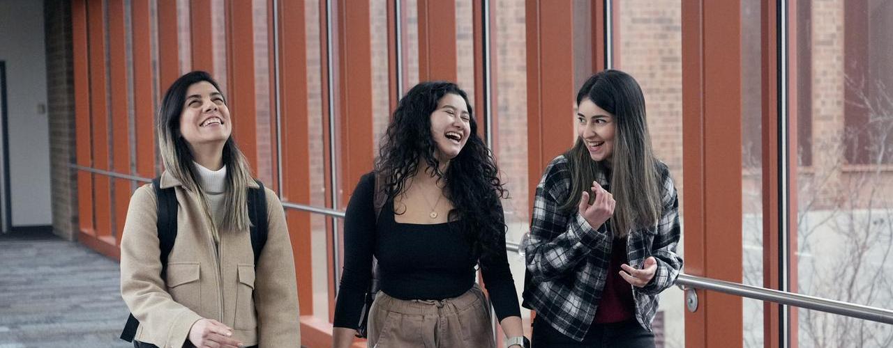 Students laughing in hallway