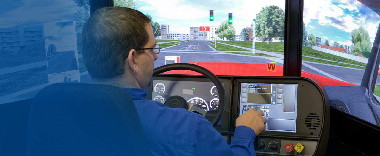 Student using truck driving simulator